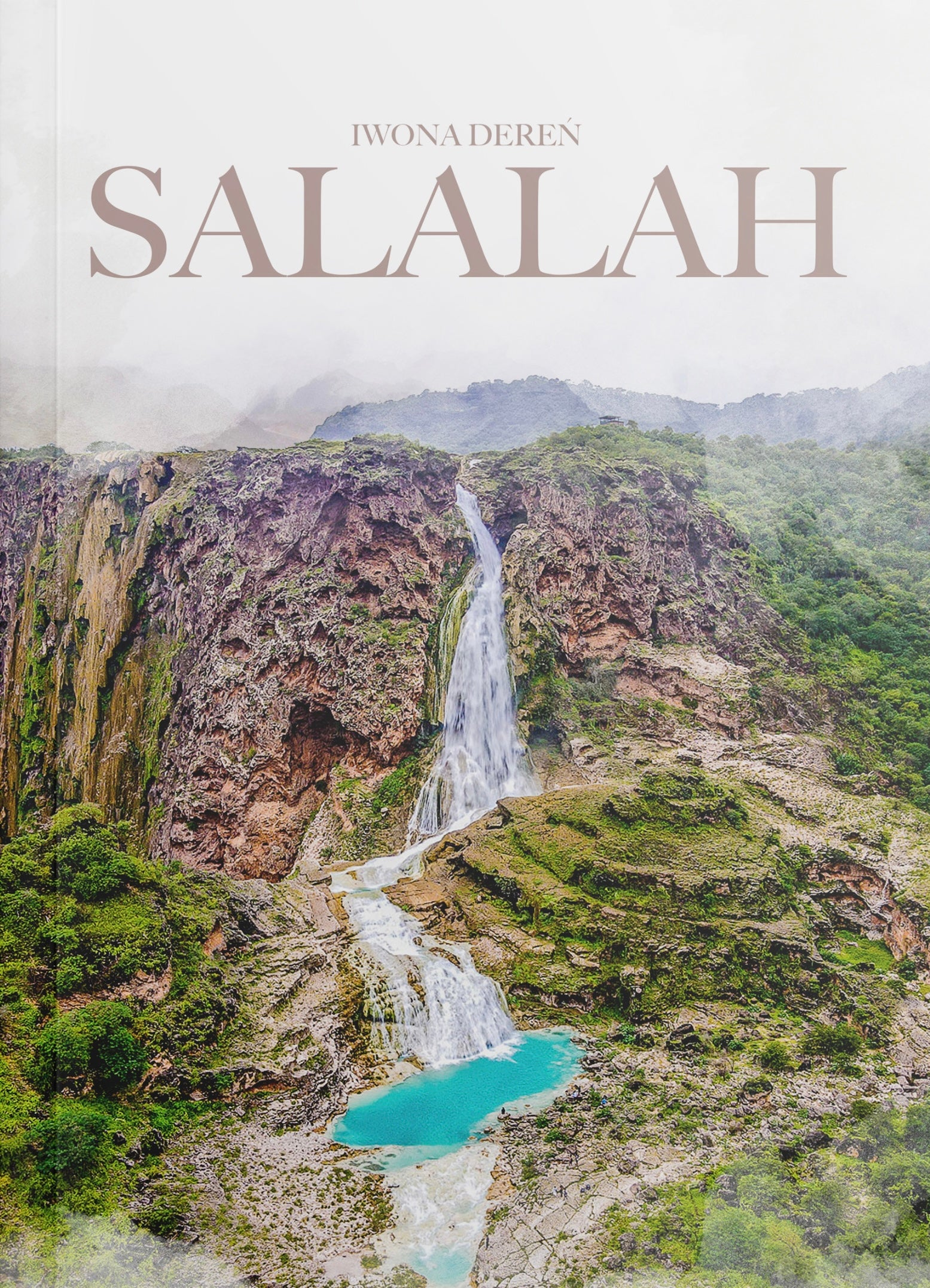 Book Cover of the Salalah Off-Road E-Guide showing a tall turquoise waterfall surrounded by lush green mountains.