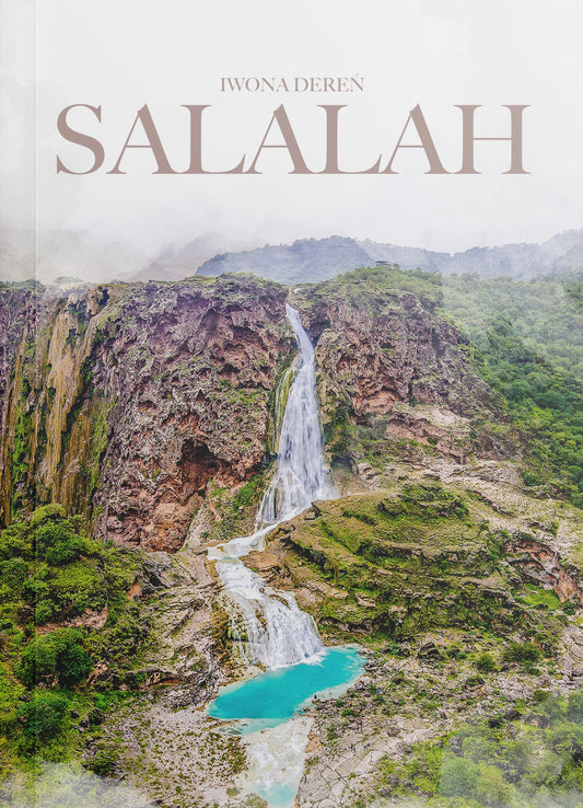 Book Cover of the Salalah Off-Road E-Guide showing a tall turquoise waterfall surrounded by lush green mountains.